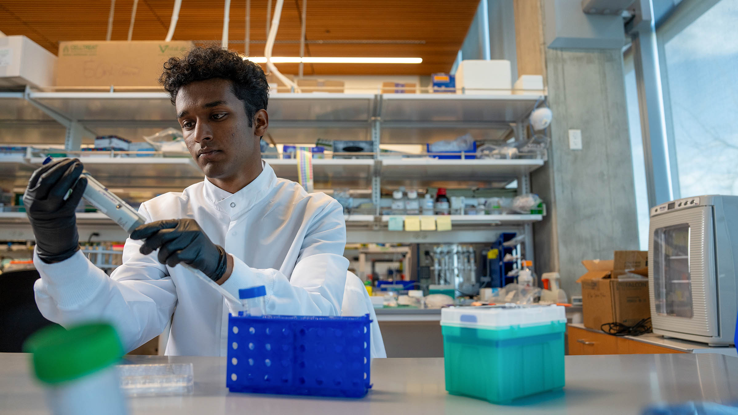 Student works in the Nick Willett lab in the Knight Campus