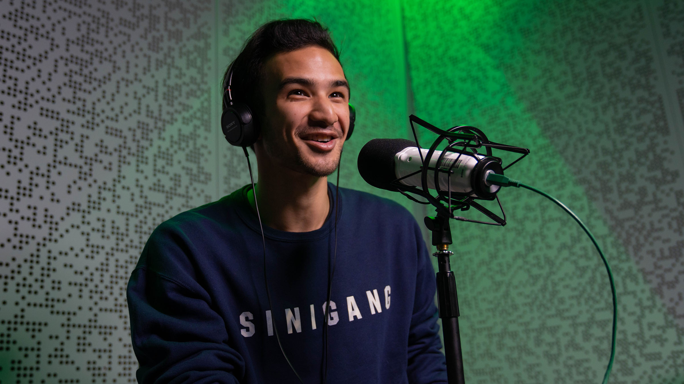 Student recording in Allen Hall podcasting studio