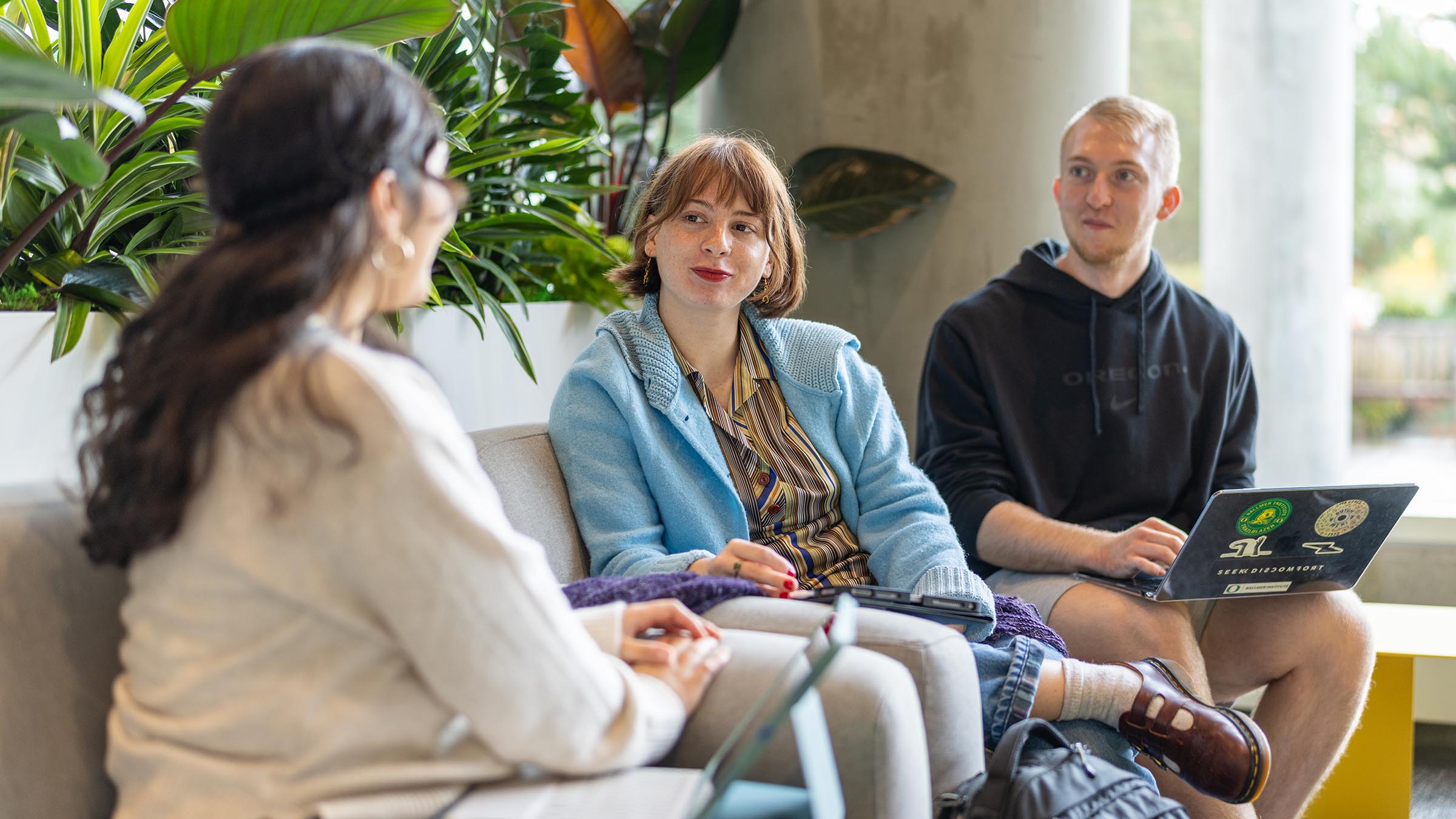 Students gathered in a campus lounge area for discussion, collaboration, and study