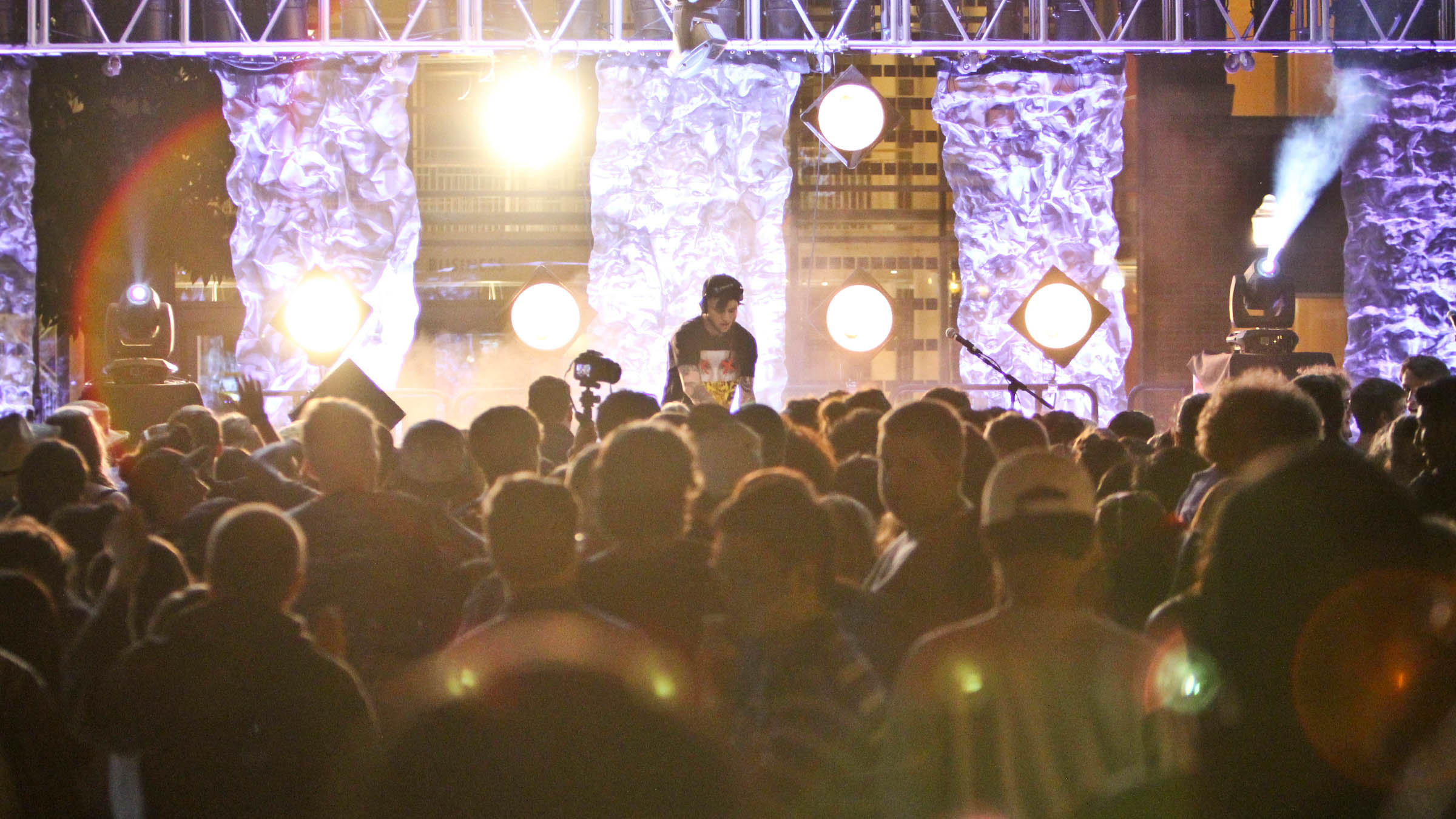 Concert on Memorial Quad with Knight Library in the background