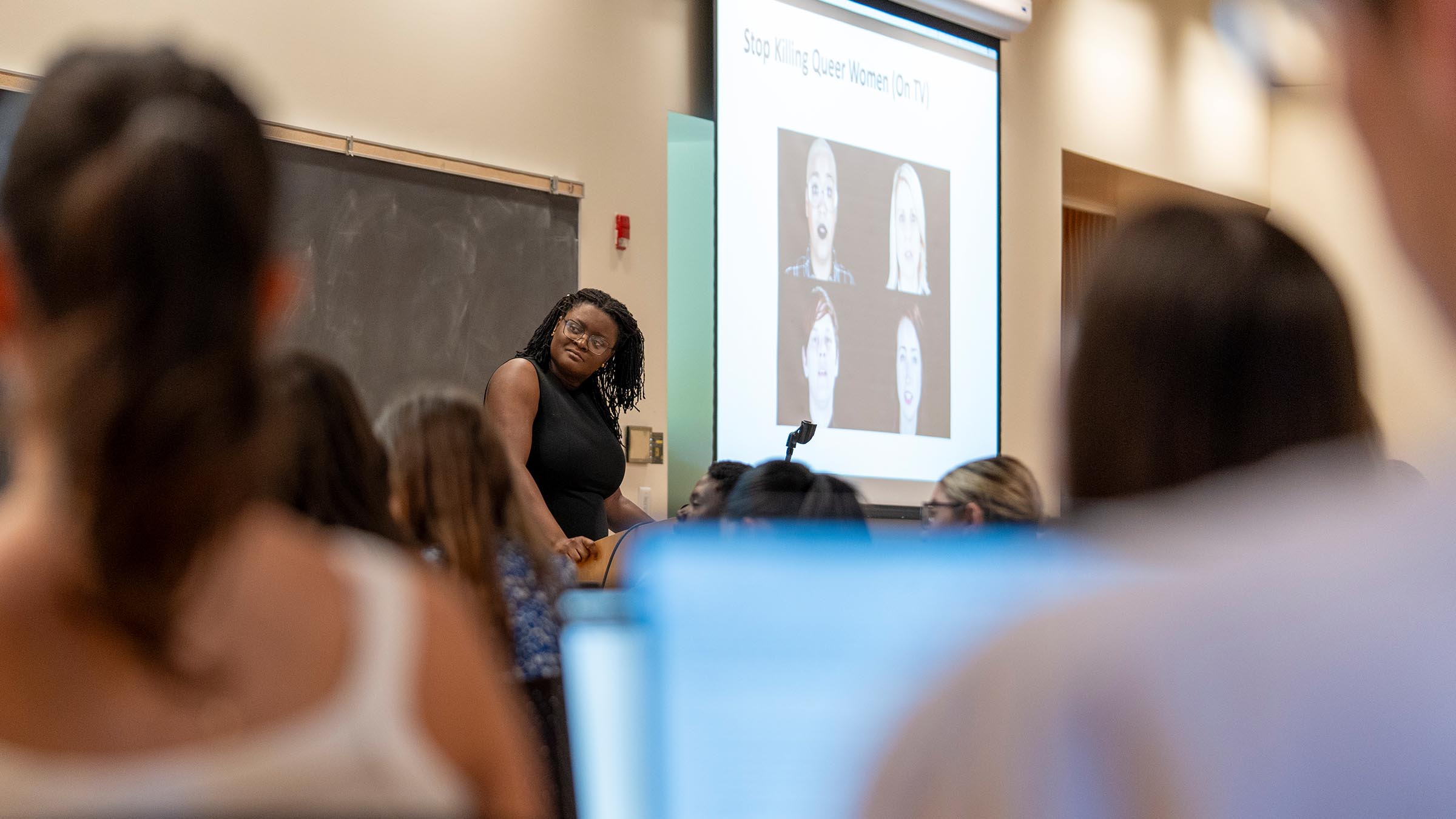 Instructor lecturing on queer representation in the media