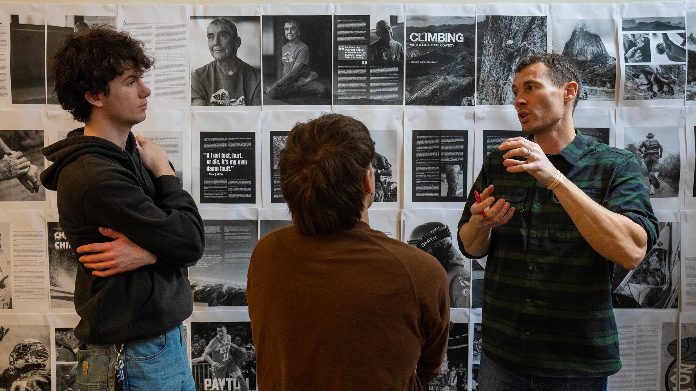 Students and instructor discussing media content, design, and communication strategies while working on an issue of Ascend Magazine