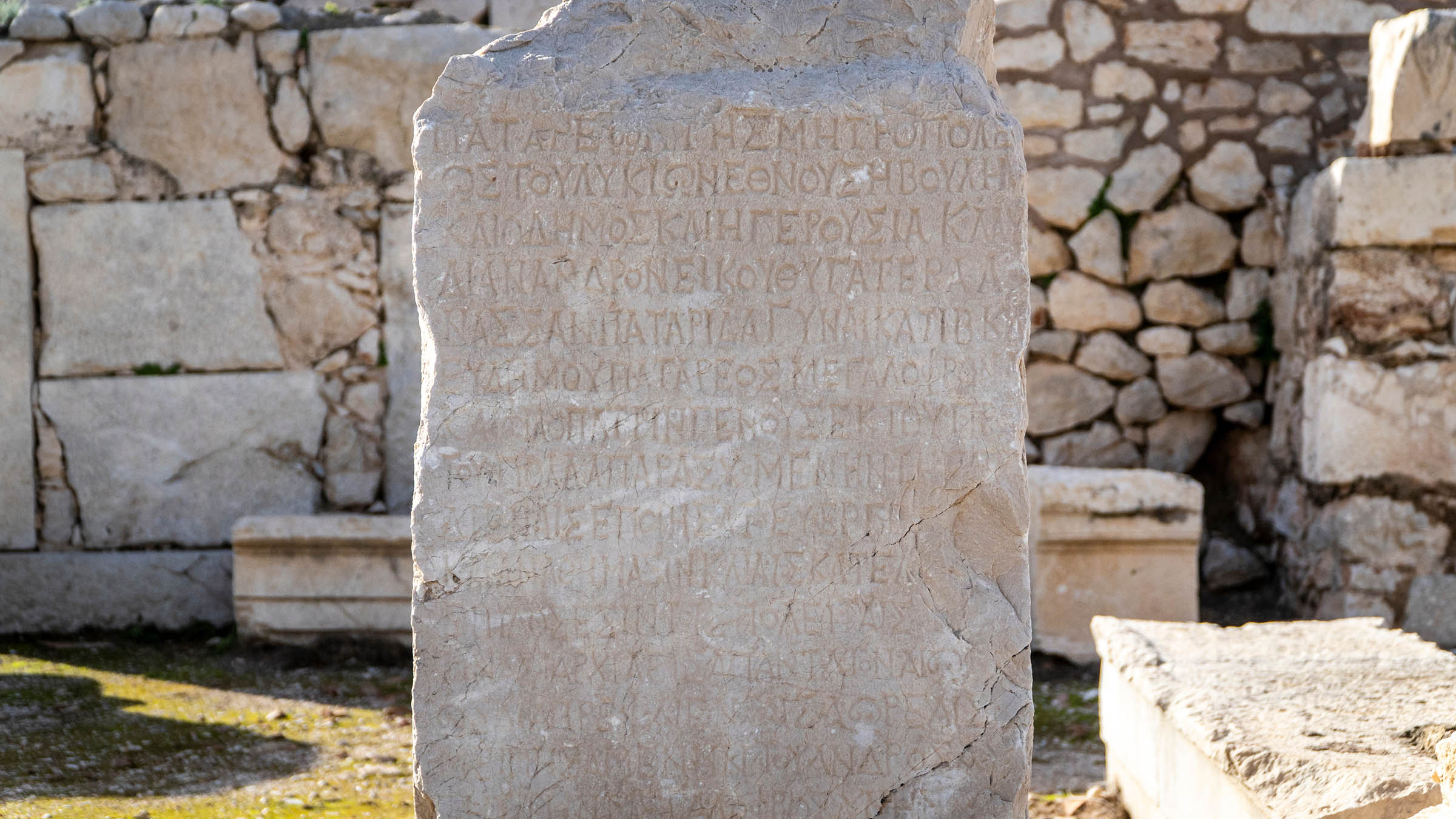 Ancient Greek inscription carved into a stone slab at the Patara archaeological site