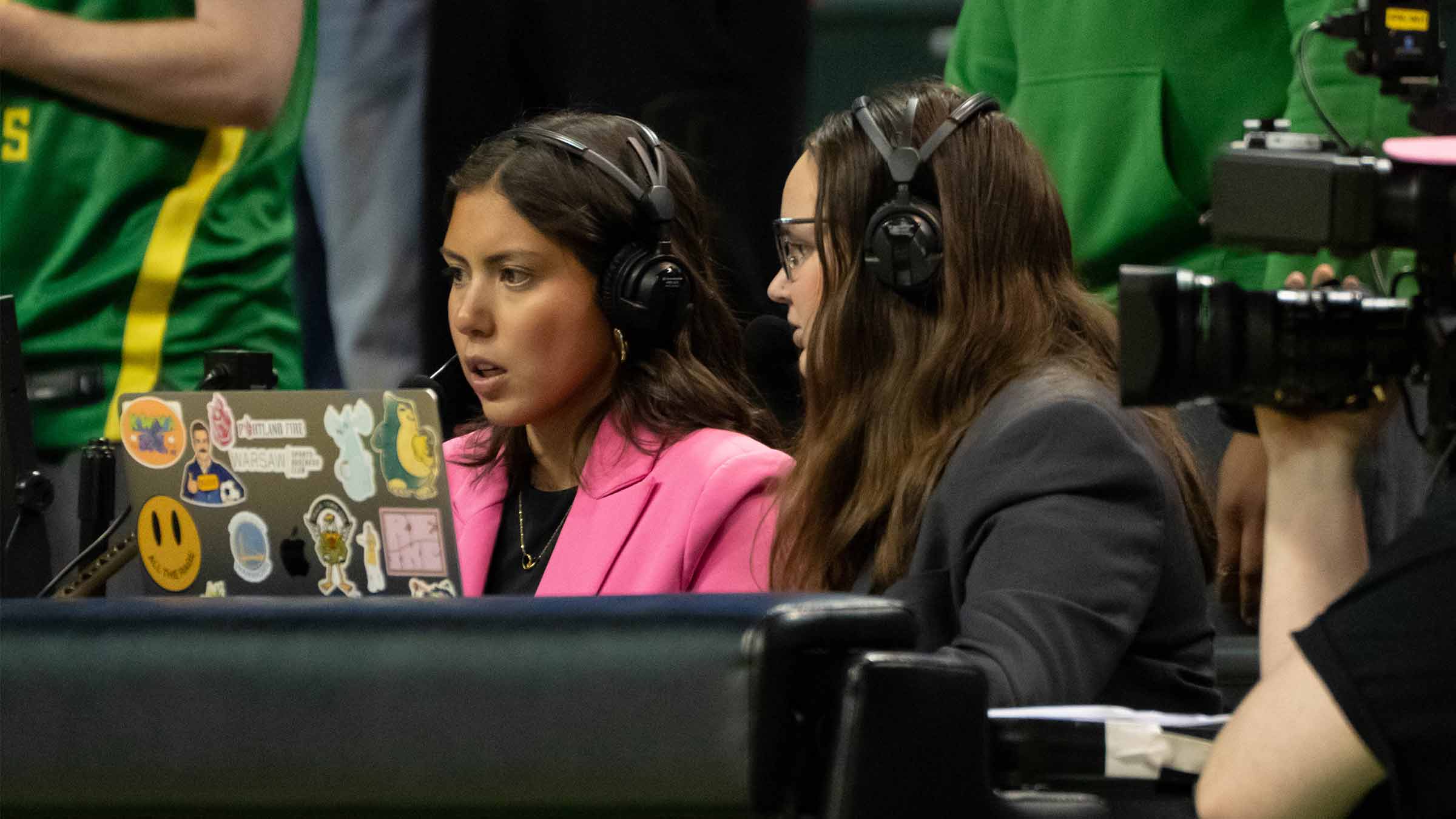 Students producing a live sports broadcast of a DUCKS basketball game