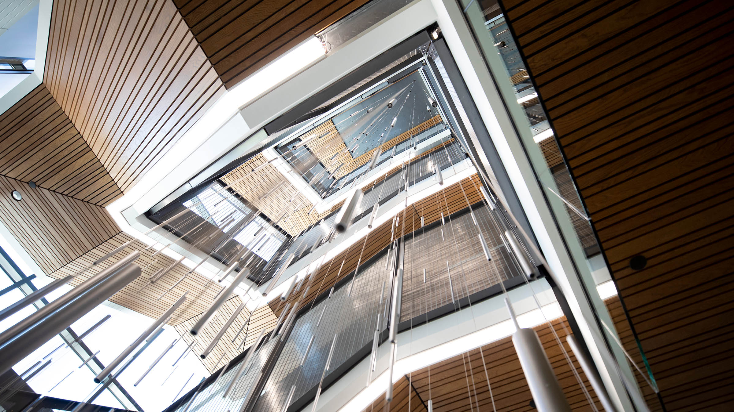Looking up a light-filled staircase in Tykeson Hall