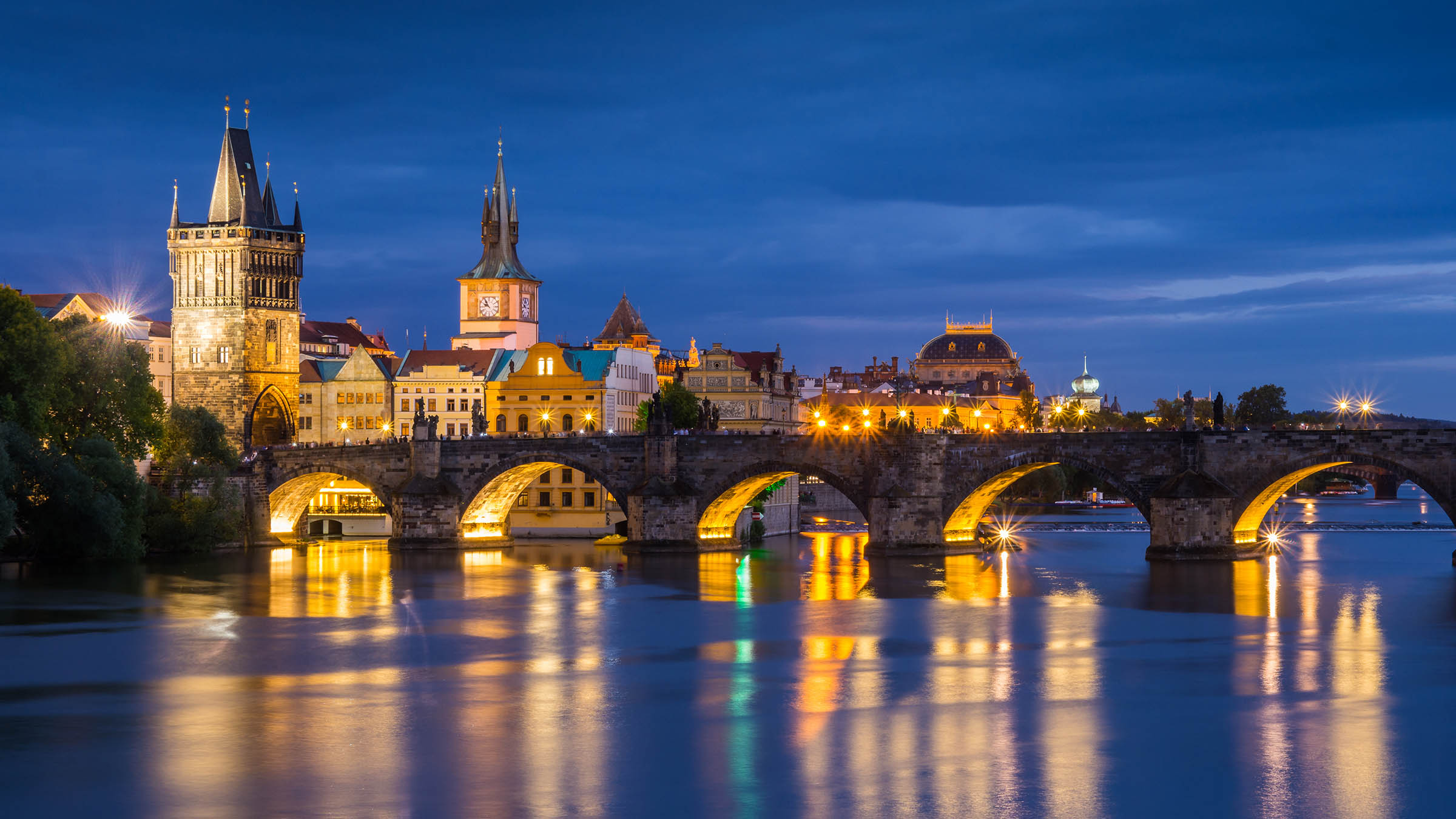 Charles Bridge over the Vltava River in Prague at night